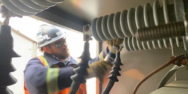 Justin Fish servicing high-voltage electrical equipment