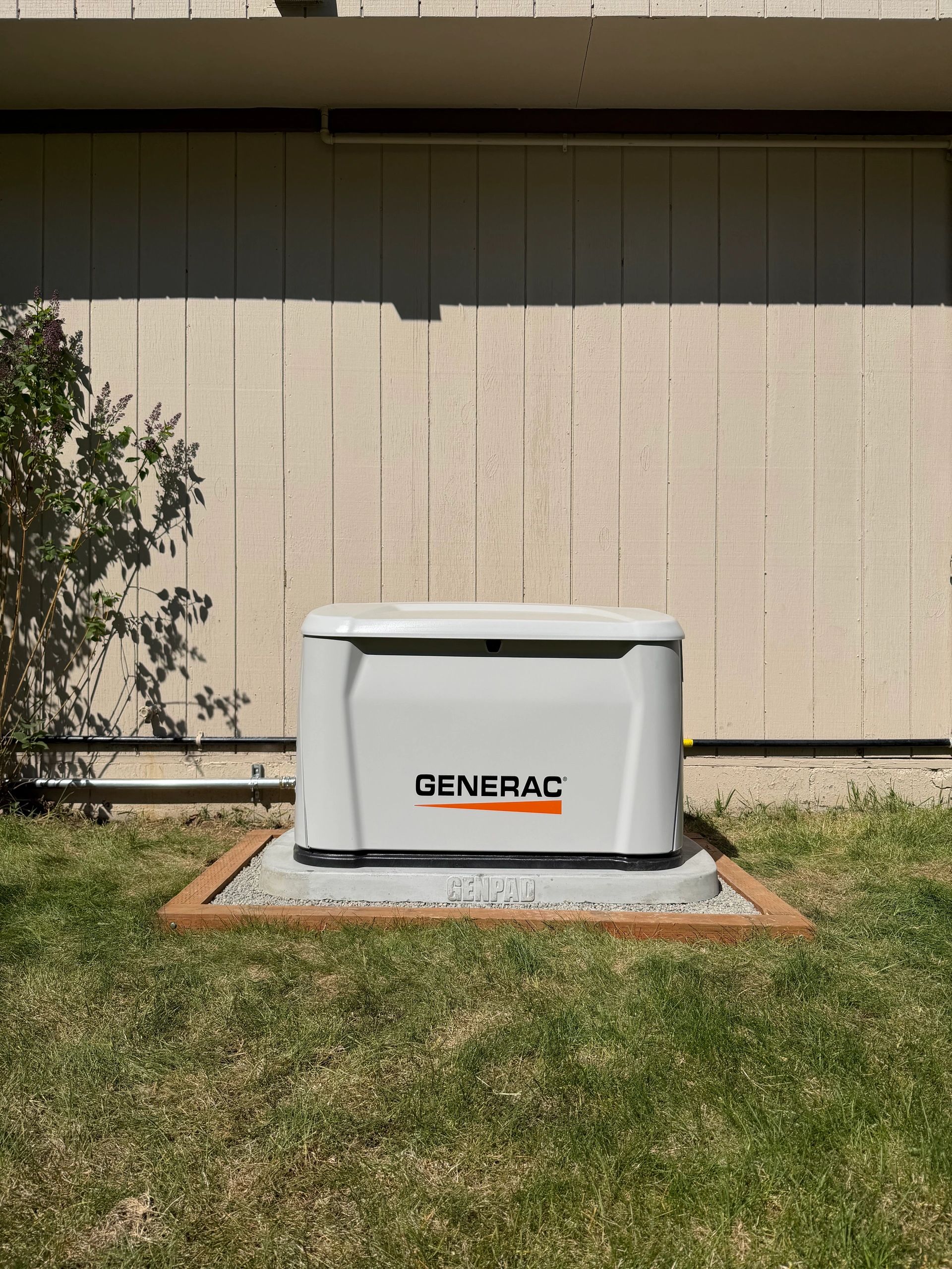 Generac standby generator beside a building